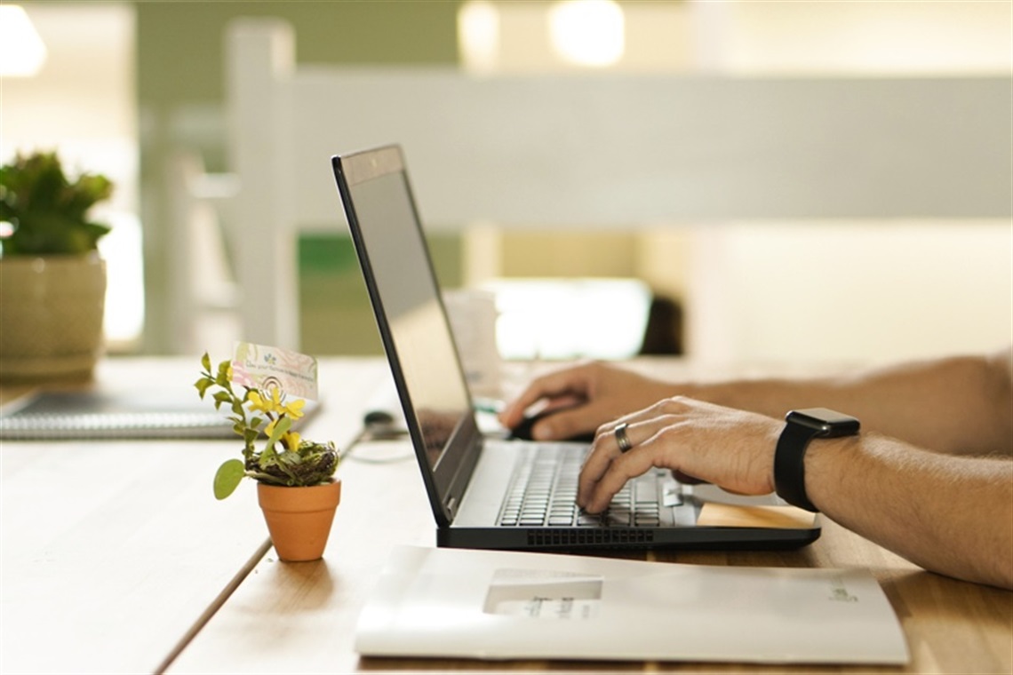 Tech Help Start - person typing at a laptop