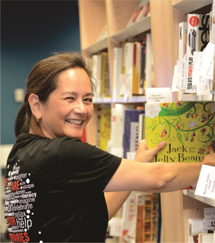 Staff member shelving books