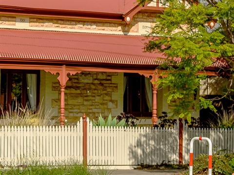 Heritage house with fence and verandah