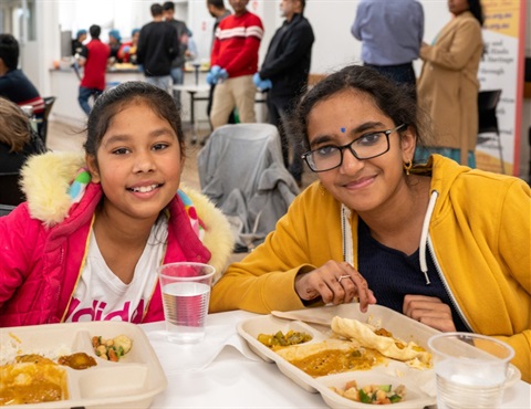 Unley in Harmony - woman and young girl enjoying lunch at Clarence Park Community Centre