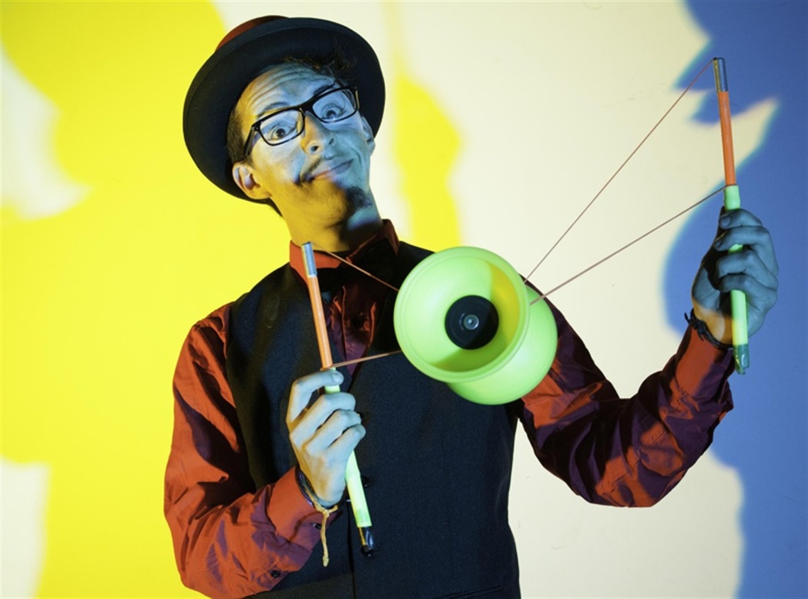 A man doing a trick possibly at the circus