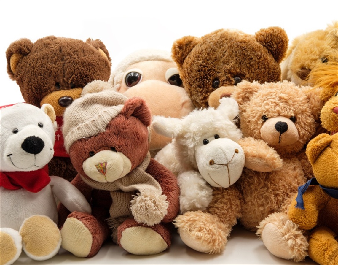 An assortment of teddy bears and other soft toys