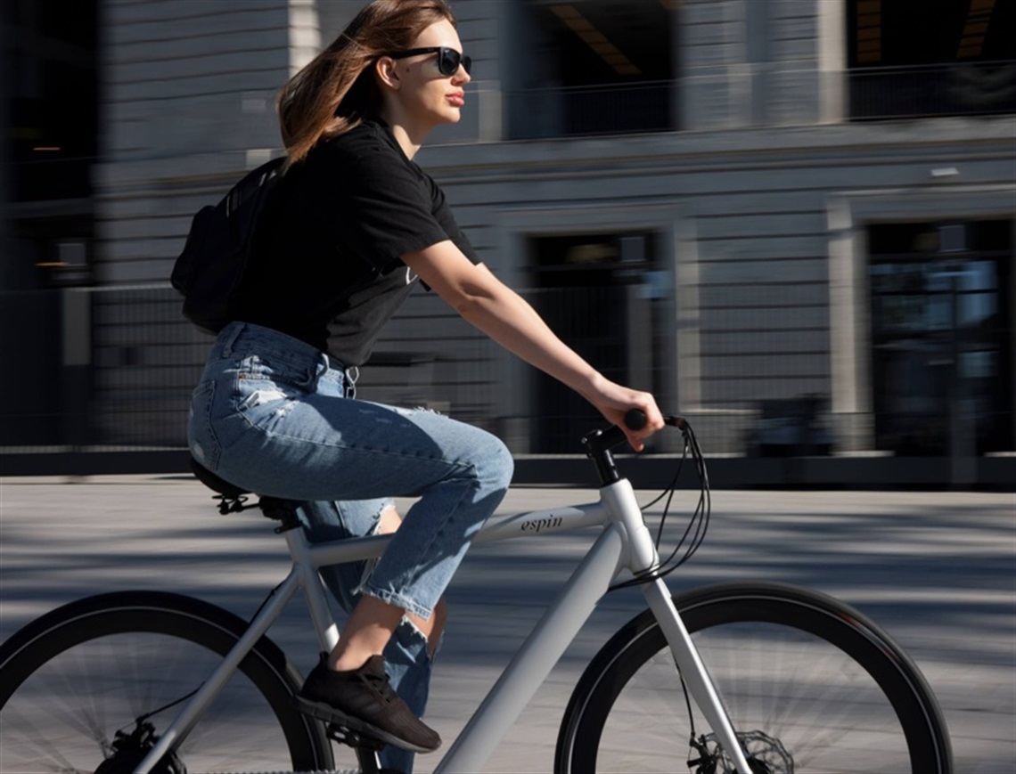 Woman riding a bicycle in a city