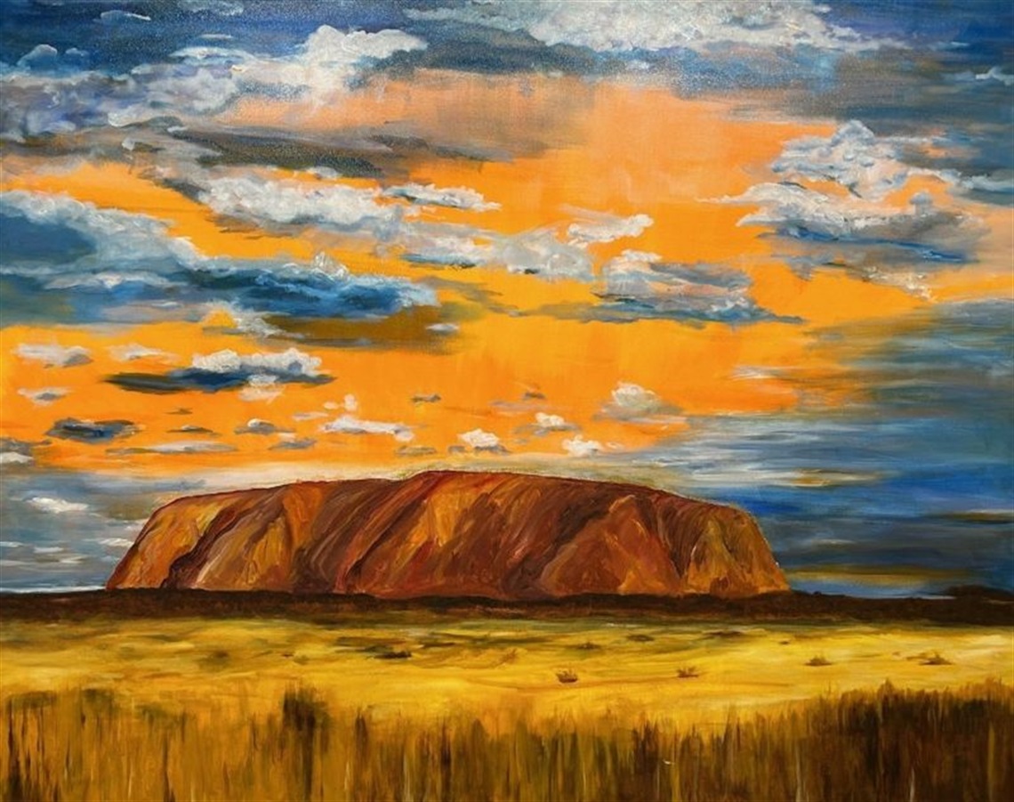 painting of Uluru rock with bright orange and blue sky