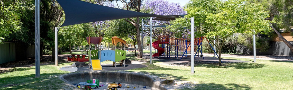 Dora Guild playground with shade and sand pit