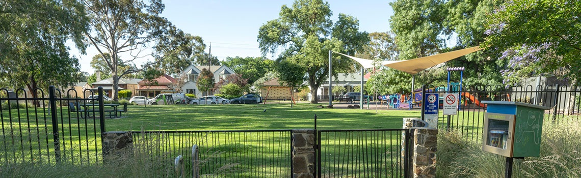 Leicester Street Reserve playground grass fenced entry