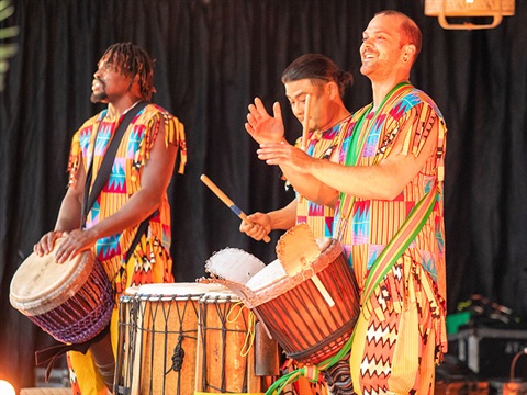 performers playing drums on stage