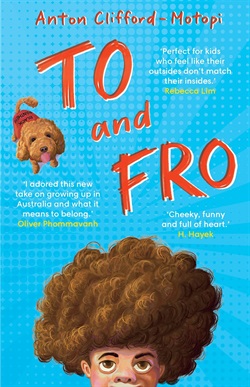 a small curly haired dog, and a boy with a big curly afro