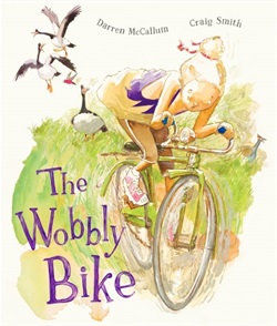 a girl rides a wobbly looking bike