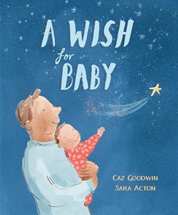 a father holds his baby as they look up at a shooting star