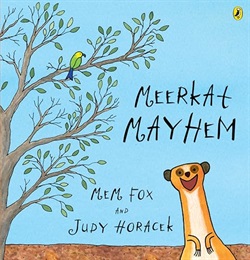 a tree on the left with a small bird on a branch, a smiling meerkat popping up on the right